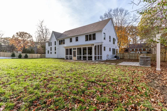 Backyard exterior of 2-story Multi Generational Home Plan, The Madison by Classic Cottages.