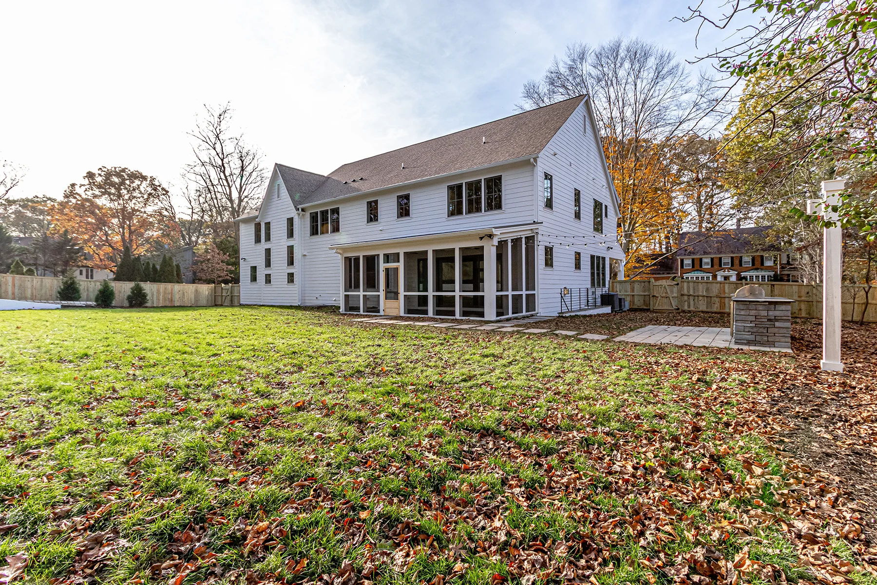 Backyard exterior of 2-story Multi Generational Home Plan, The Madison by Classic Cottages.