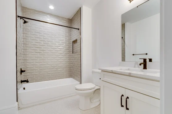 Secondary bathroom in Multi Generational Home Plan, The Madison by Classic Cottages.
