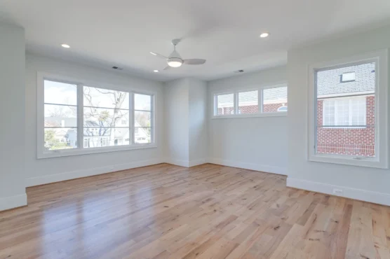 Ten Foot Ceilings, Arlington Luxury Home Plan, Ridgeview Sunlit hardwood floors in spacious room